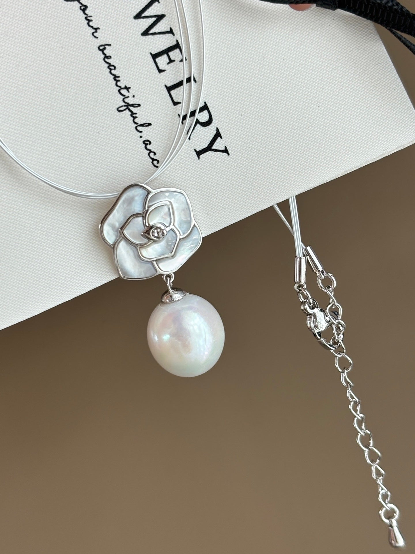 Close-up of camellia flower and 12mm teardrop pearl accent