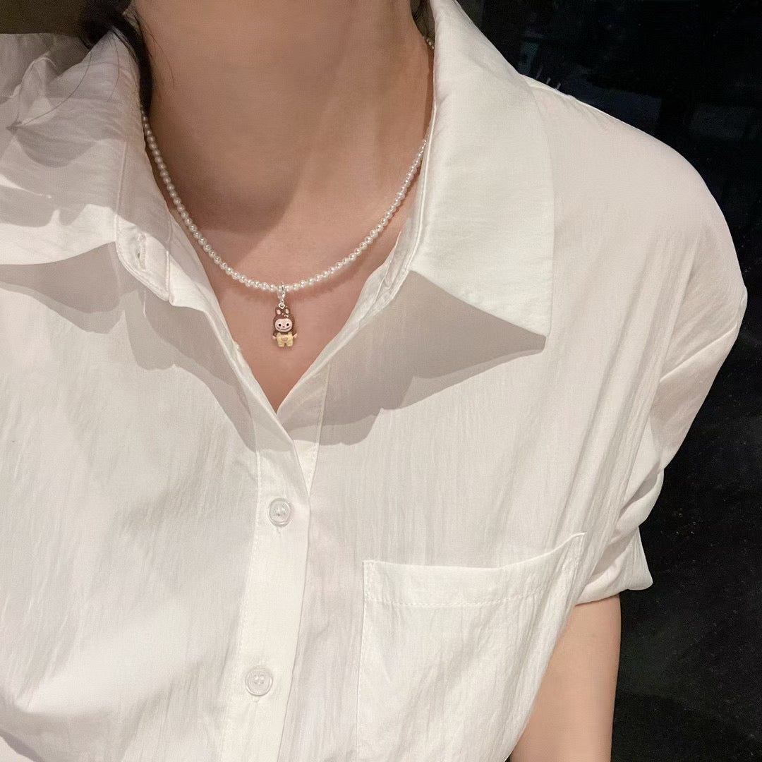 Model wearing colorful adjustable pearl necklace