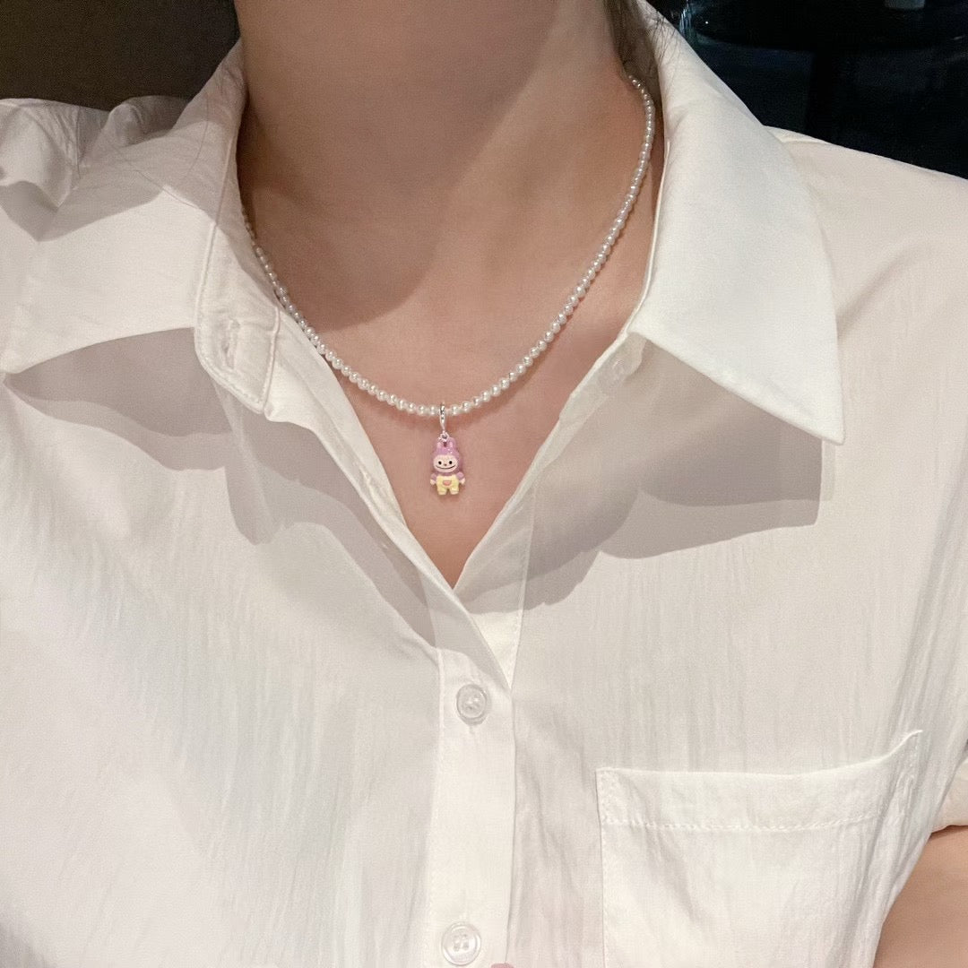 Model wearing colorful adjustable pearl necklace