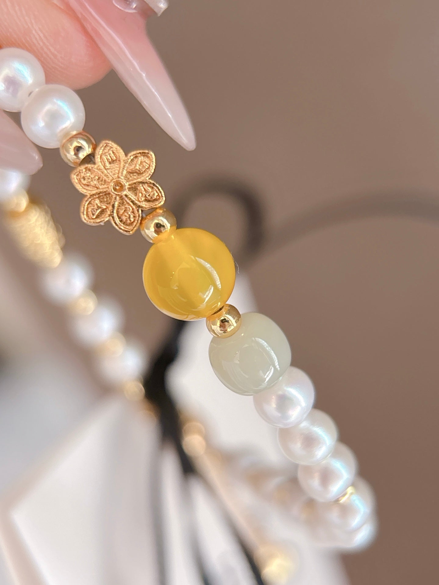 Close-up of natural pearls and sparkling crystal accents