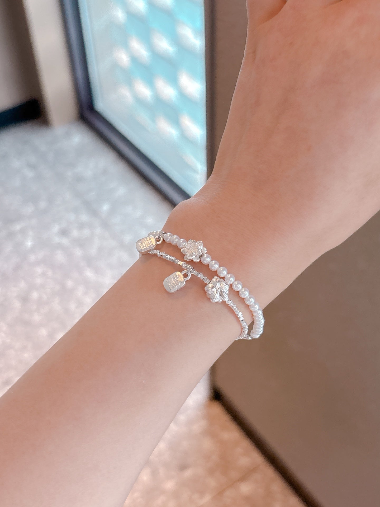 Model wearing new Chinese style silver lotus bracelet