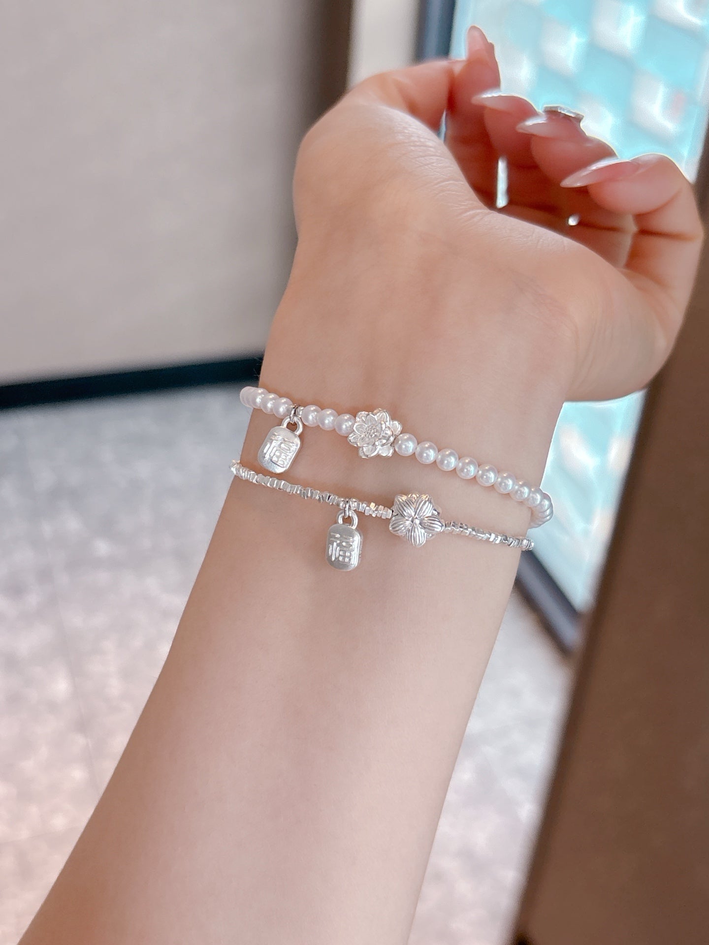 Model wearing new Chinese style silver lotus bracelet