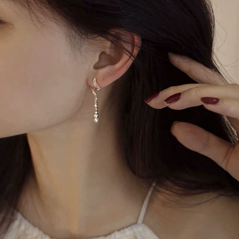 Model wearing elegant moonlight tassel earrings