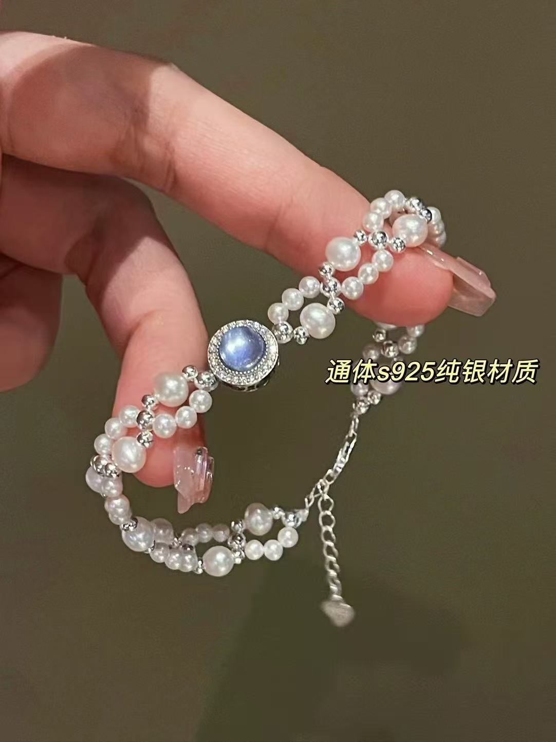 Close-up of 3–6mm lustrous pearls with silver weaving and aquamarine beads