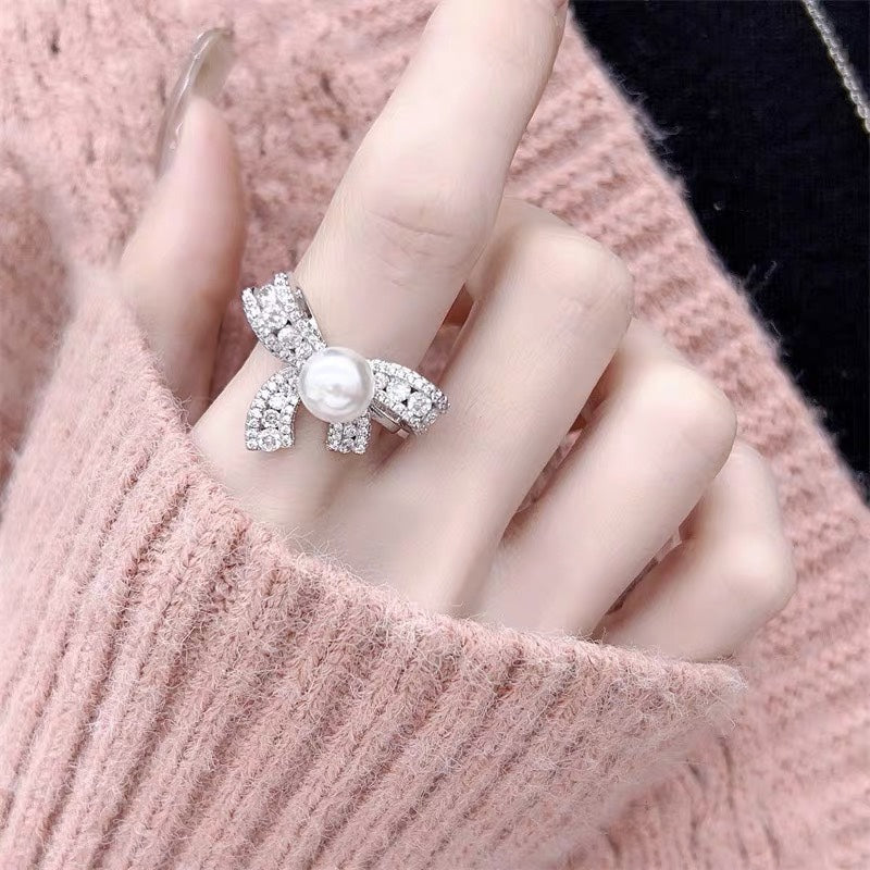 Close-up of dazzling bow pearl ring