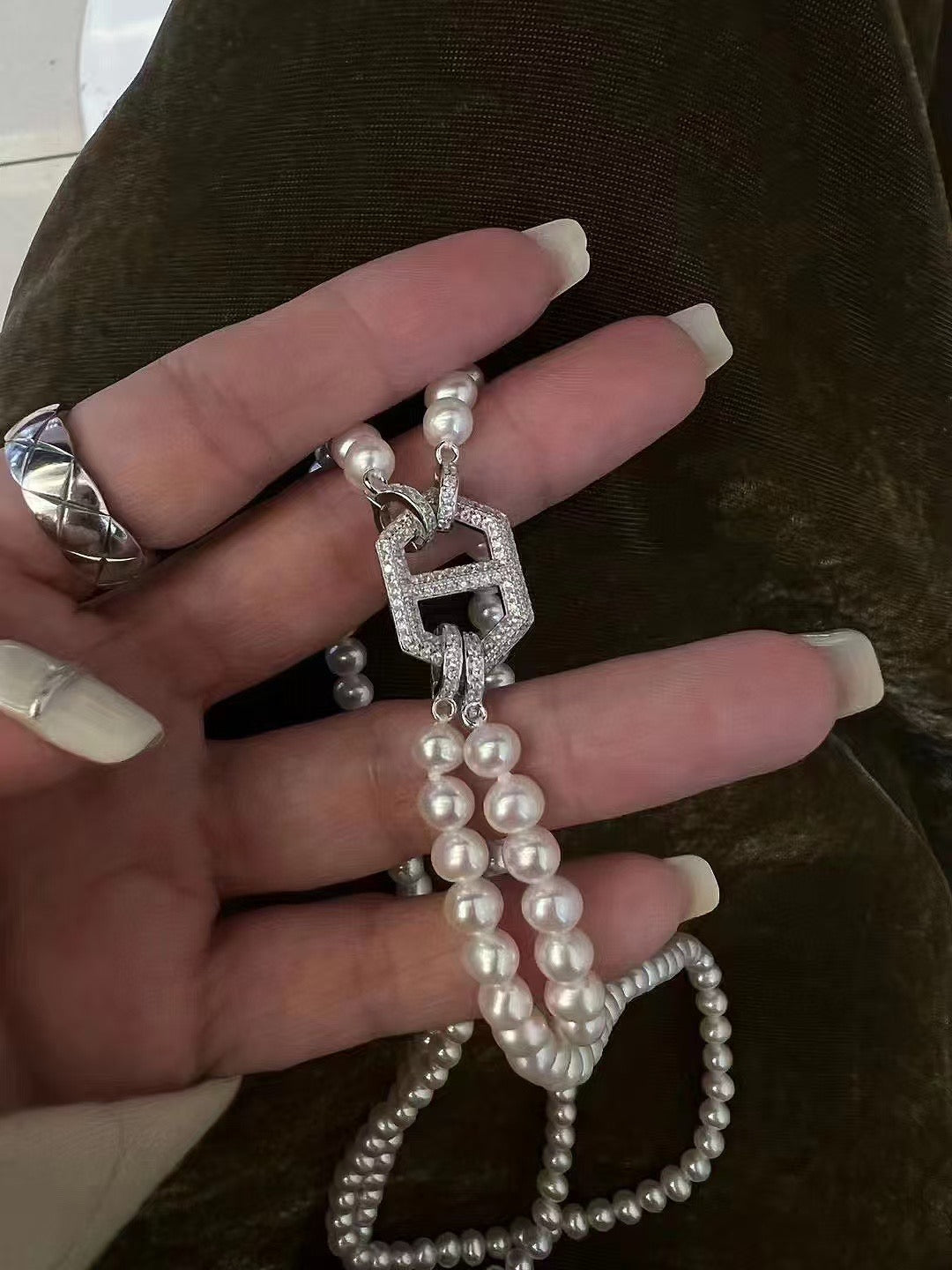 Close-up of 4–5mm pearls and sparkling bling clasp