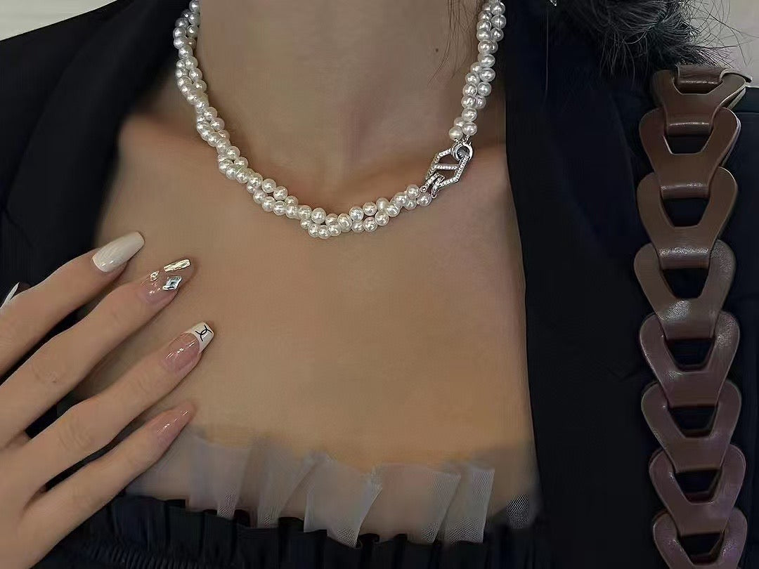 Model wearing pearl choker in layered and wrap-around style