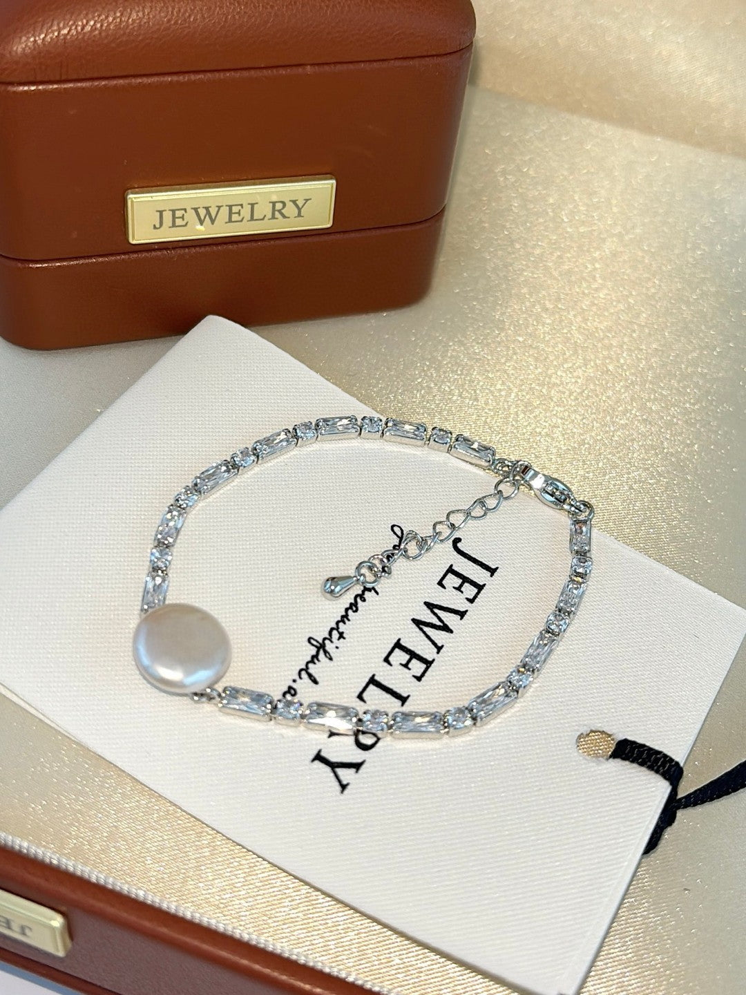 Baroque button pearl bracelet with aurora finish and zircon accents