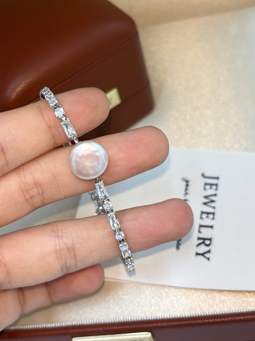 Close-up of button pearls and intricate new Chinese style setting