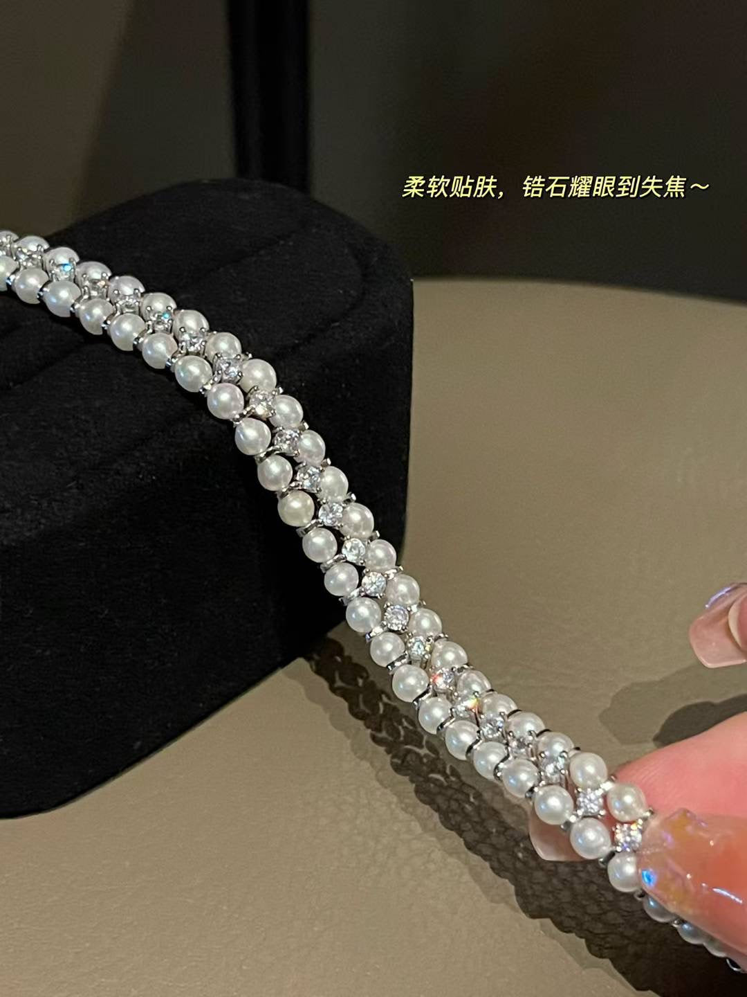 Close-up of 3–4mm freshwater pearls with sparkling zircon settings