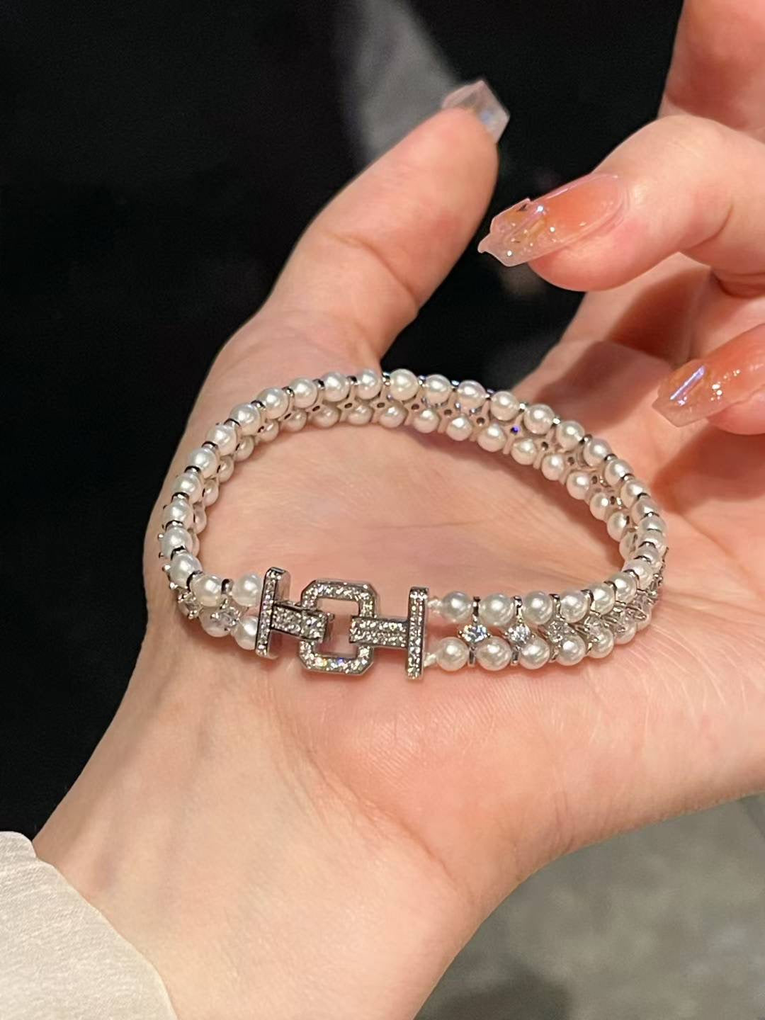 Close-up of 3–4mm freshwater pearls with sparkling zircon settings