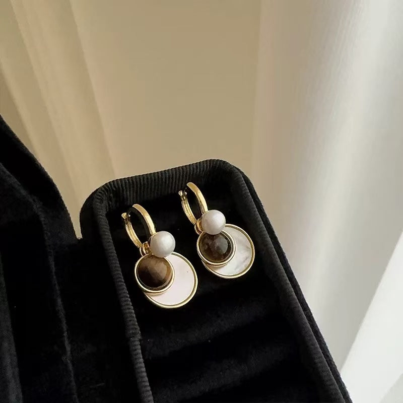 Earrings in warm Maillard-inspired tones