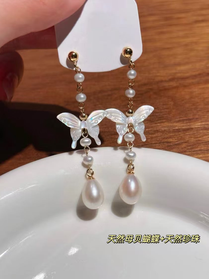 White mother-of-pearl butterfly earrings with tassels and freshwater pearls in Chinese-style design