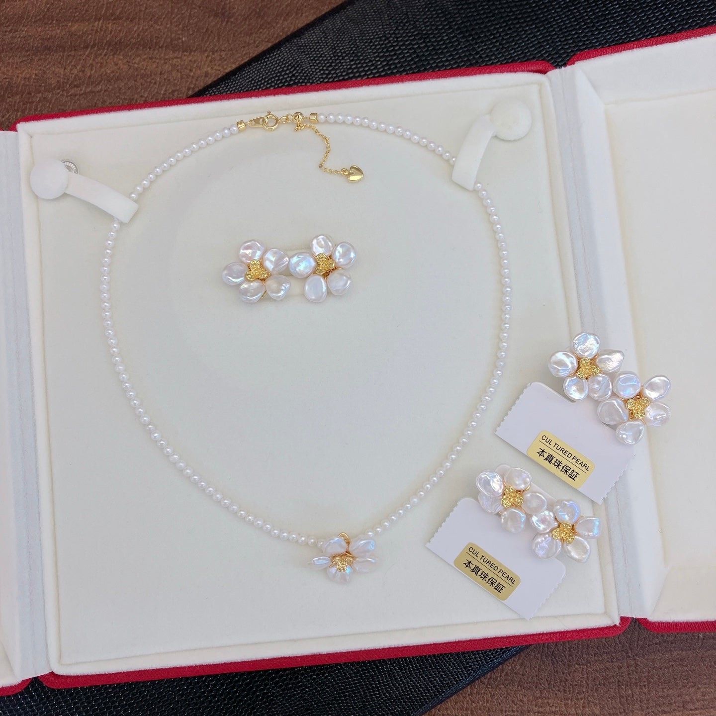 A handcrafted pearl necklace and earrings set featuring delicate petal designs and 3.5–4mm freshwater pearls, perfect for spring.