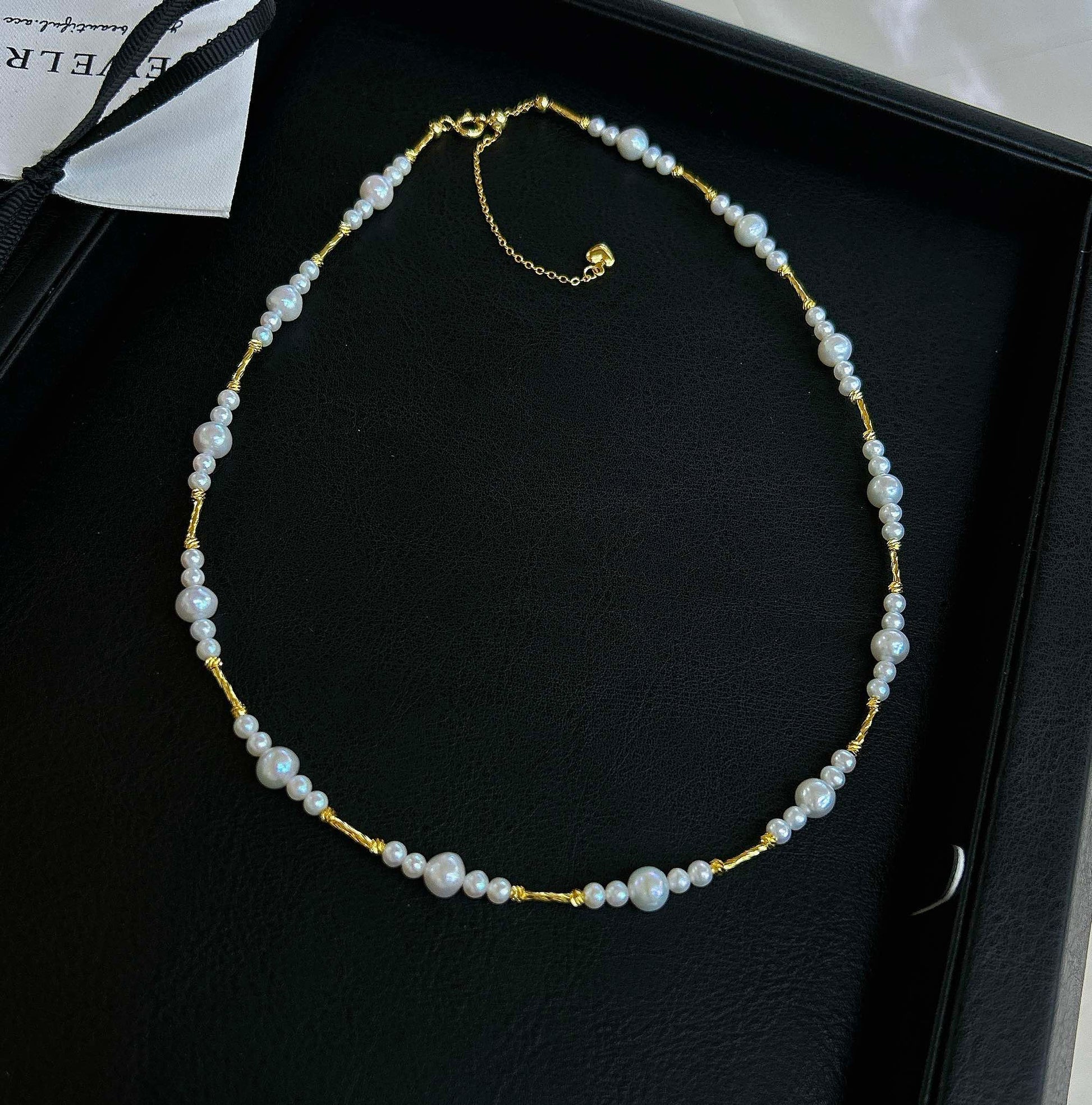 Gradient freshwater baby pearl necklace featuring 3–7mm pearls with adjustable clasp for a perfect fit.