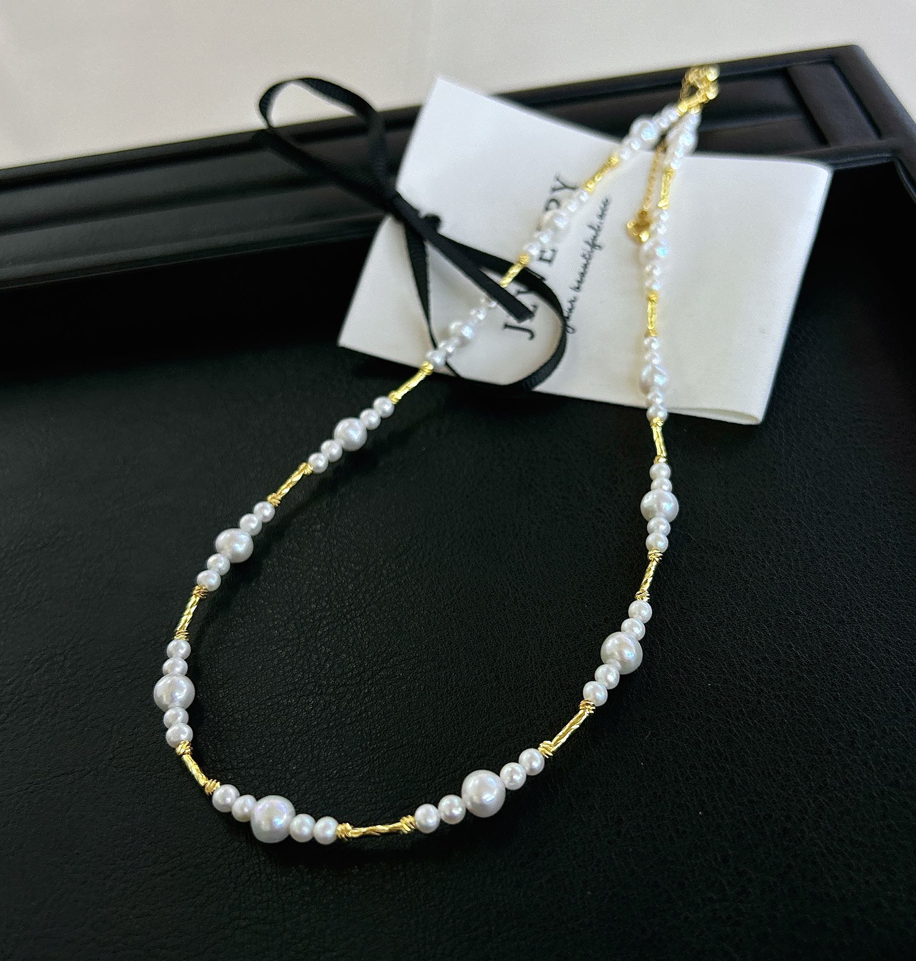 Gradient freshwater baby pearl necklace featuring 3–7mm pearls with adjustable clasp for a perfect fit.