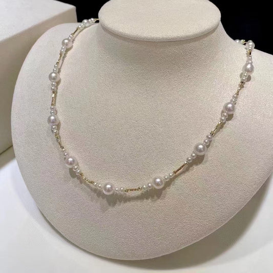Gradient freshwater baby pearl necklace featuring 3–7mm pearls with adjustable clasp for a perfect fit.
