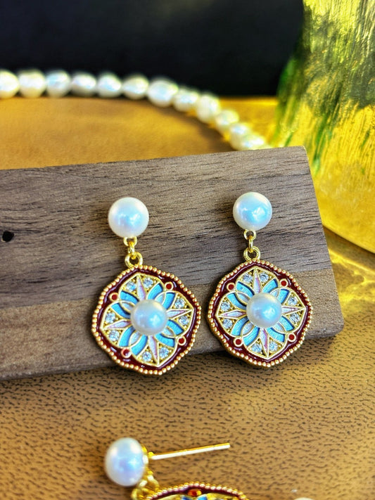 Elegant twin pearl stud earrings inspired by clover design in sterling silver