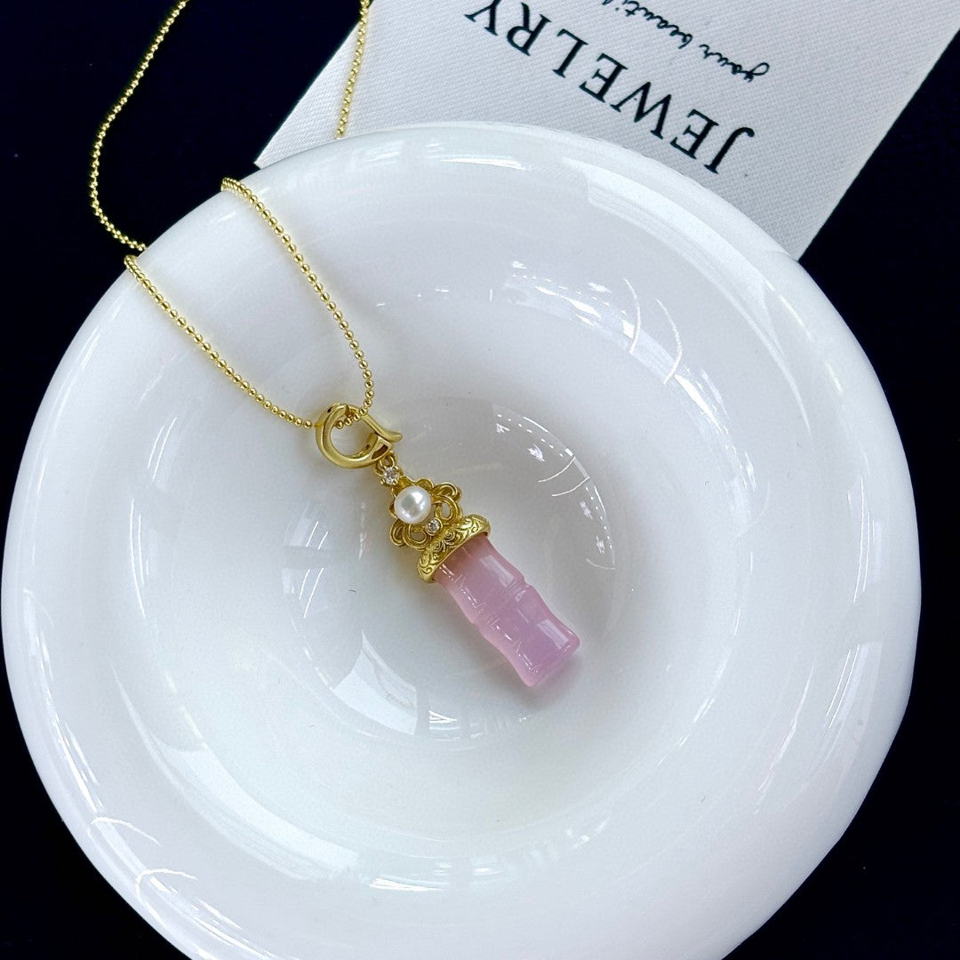 Jade and freshwater pearl pendant with bamboo-inspired gold accent