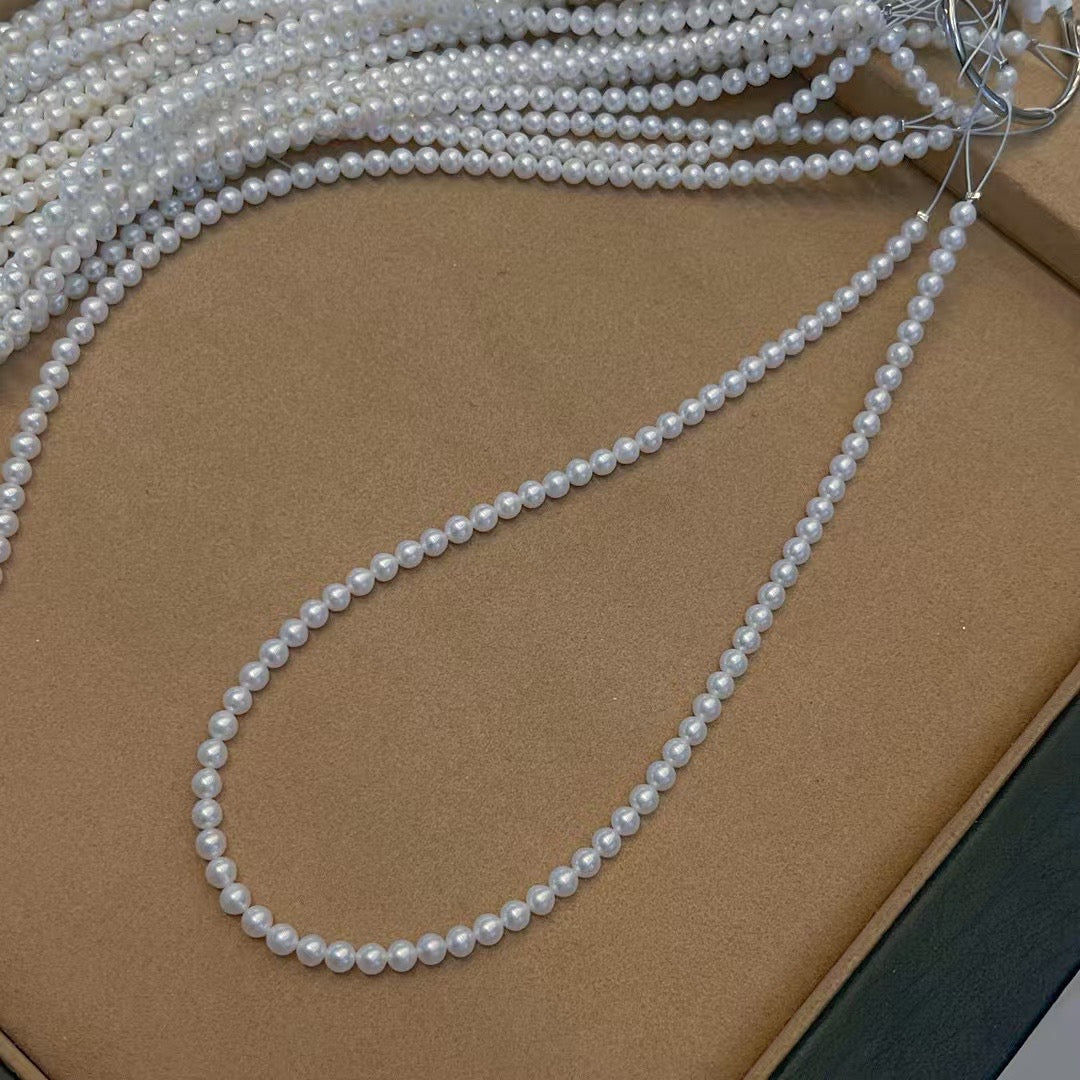 High-luster near-round freshwater pearl necklace with bonus pearl studs