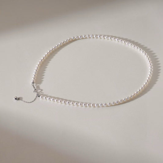 High-luster near-round freshwater pearl necklace with bonus pearl studs