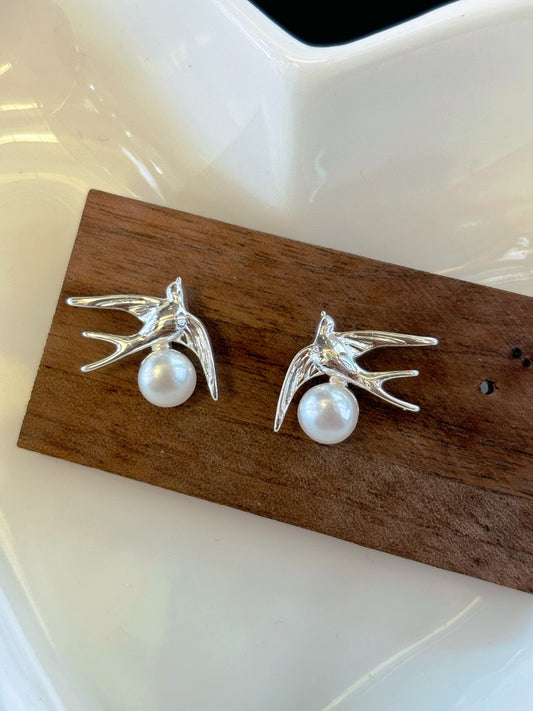Silver swallow earrings with freshwater pearls by AnSes & Co.