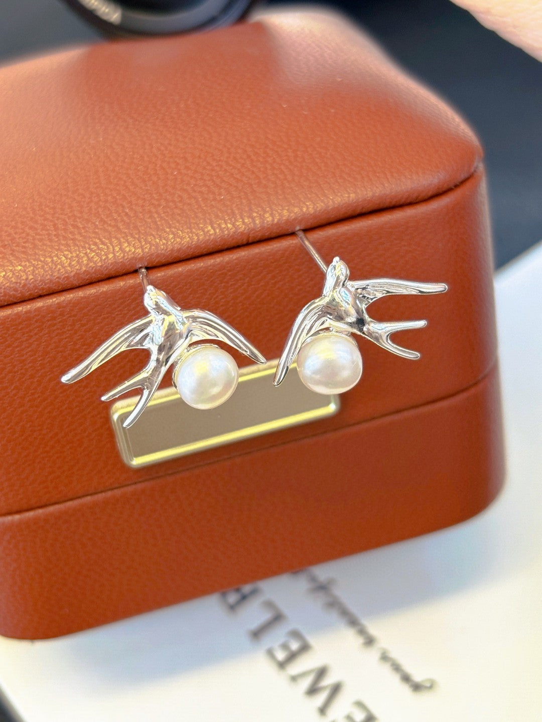 Silver swallow earrings with freshwater pearls by AnSes & Co.