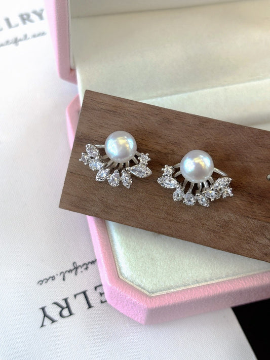 Radiant freshwater pearl stud earrings set in sterling silver.