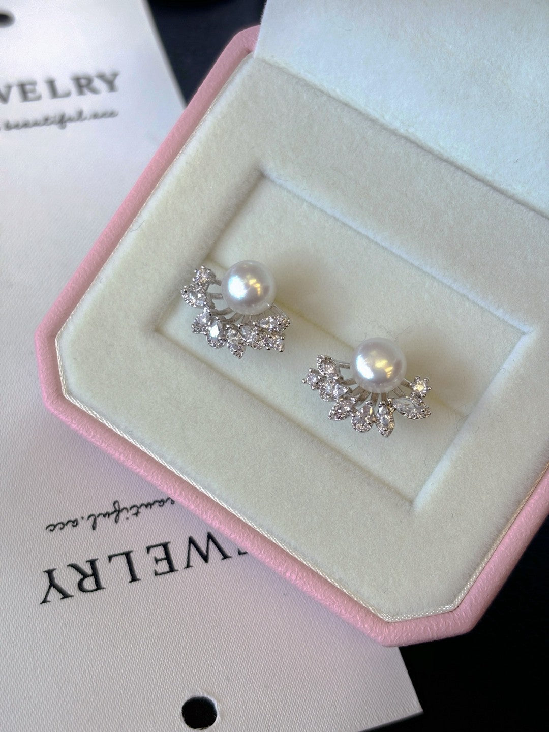 Radiant freshwater pearl stud earrings set in sterling silver.
