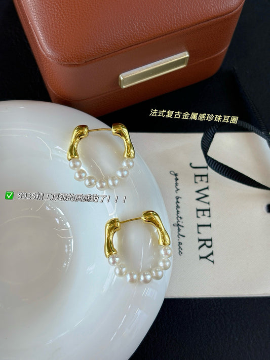 French-style vintage pearl earrings with dual-wear swing design.