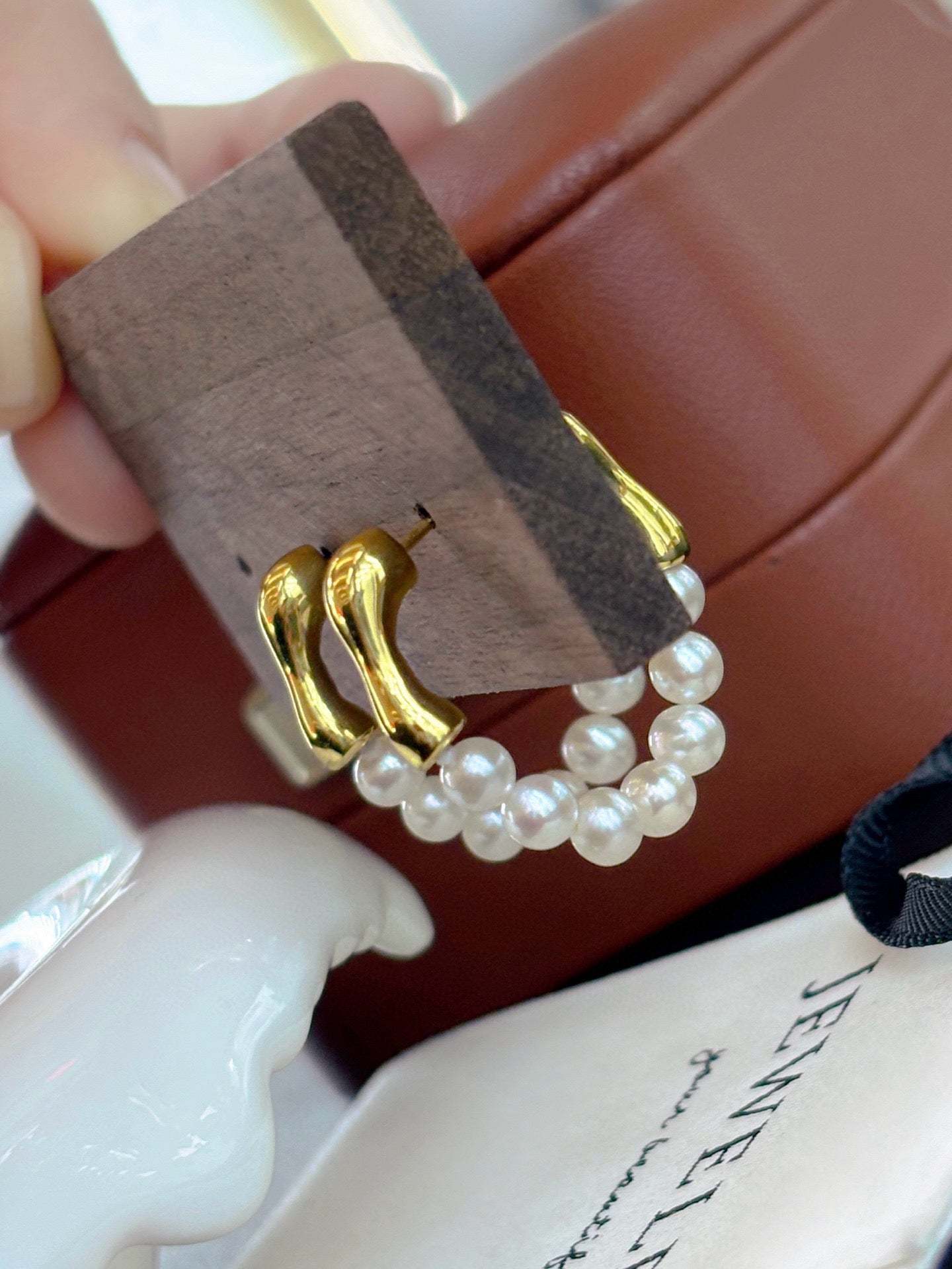 French-style vintage pearl earrings with dual-wear swing design.