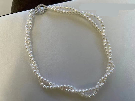 Elegant double-layer freshwater pearl choker with gold zircon clasp