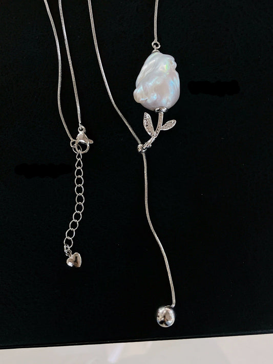 Y-shaped necklace with baroque freshwater pearls and rose charm, adjustable design