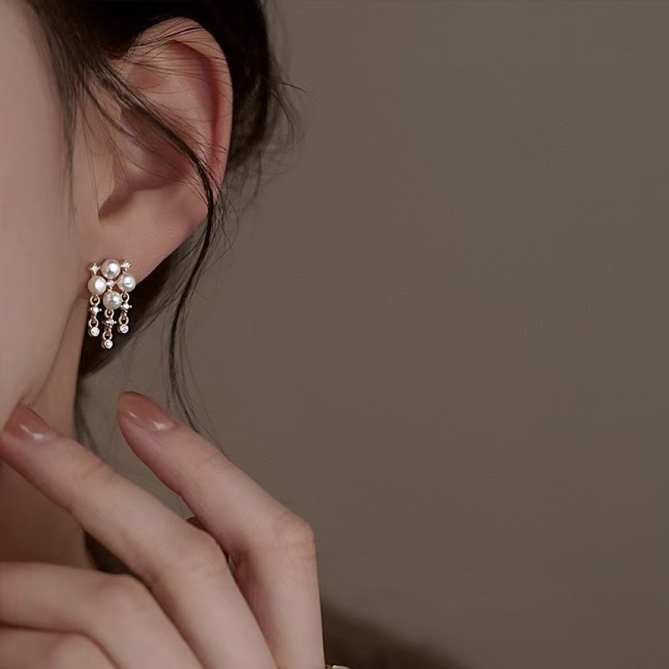 Sterling silver pearl earrings with four-leaf clover design and 4-5mm freshwater pearls