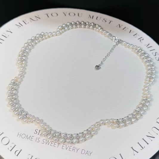Floral wave design pearl necklace handcrafted with 3–5mm high-quality freshwater pearls, elegant artisan jewelry piece