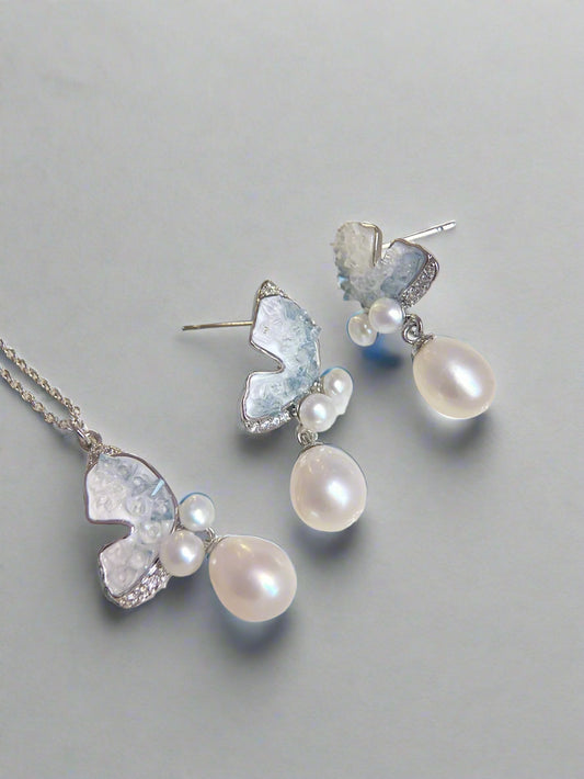 Clear Blue Ice Butterfly jewelry set featuring freshwater pearls and butterfly accents on white background