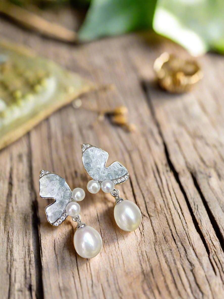 Butterfly-themed earrings with multi-pearl drop design and gold-filled finish