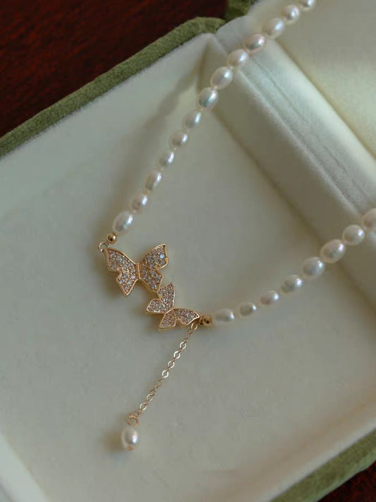utterfly pearl choker necklace with freshwater rice pearls on white background