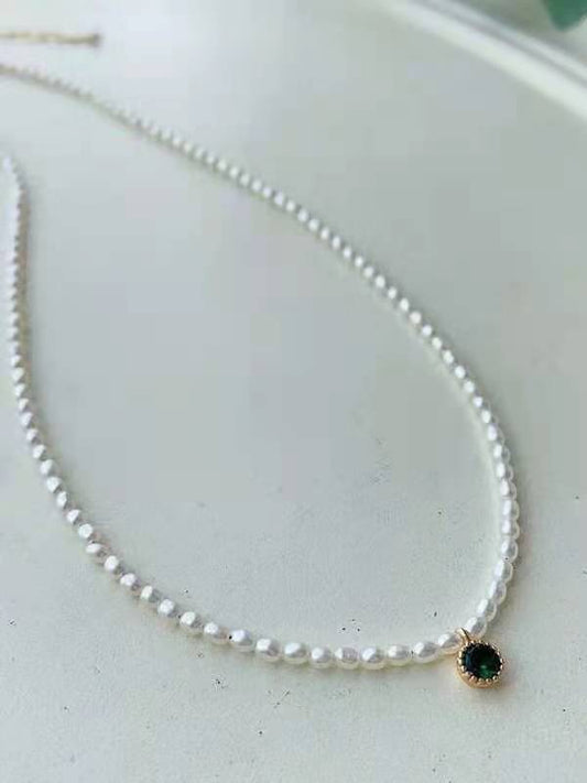3mm mini pearl necklace with green crystal accent on white background