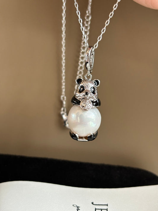 Adorable panda pendant holding a 13–14mm Edison pearl on white background