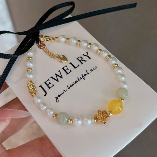 Close-up of natural pearls and sparkling crystal accents