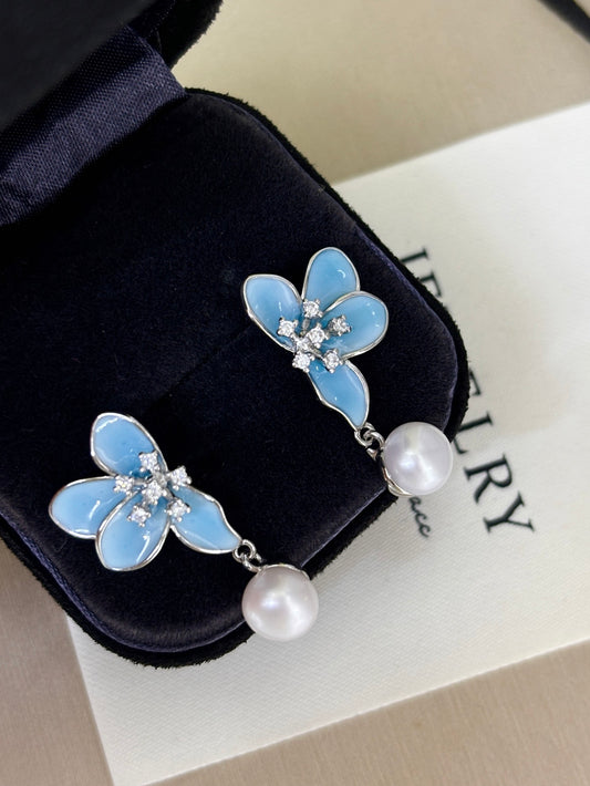 Blue petal stud earrings with freshwater pearl center 