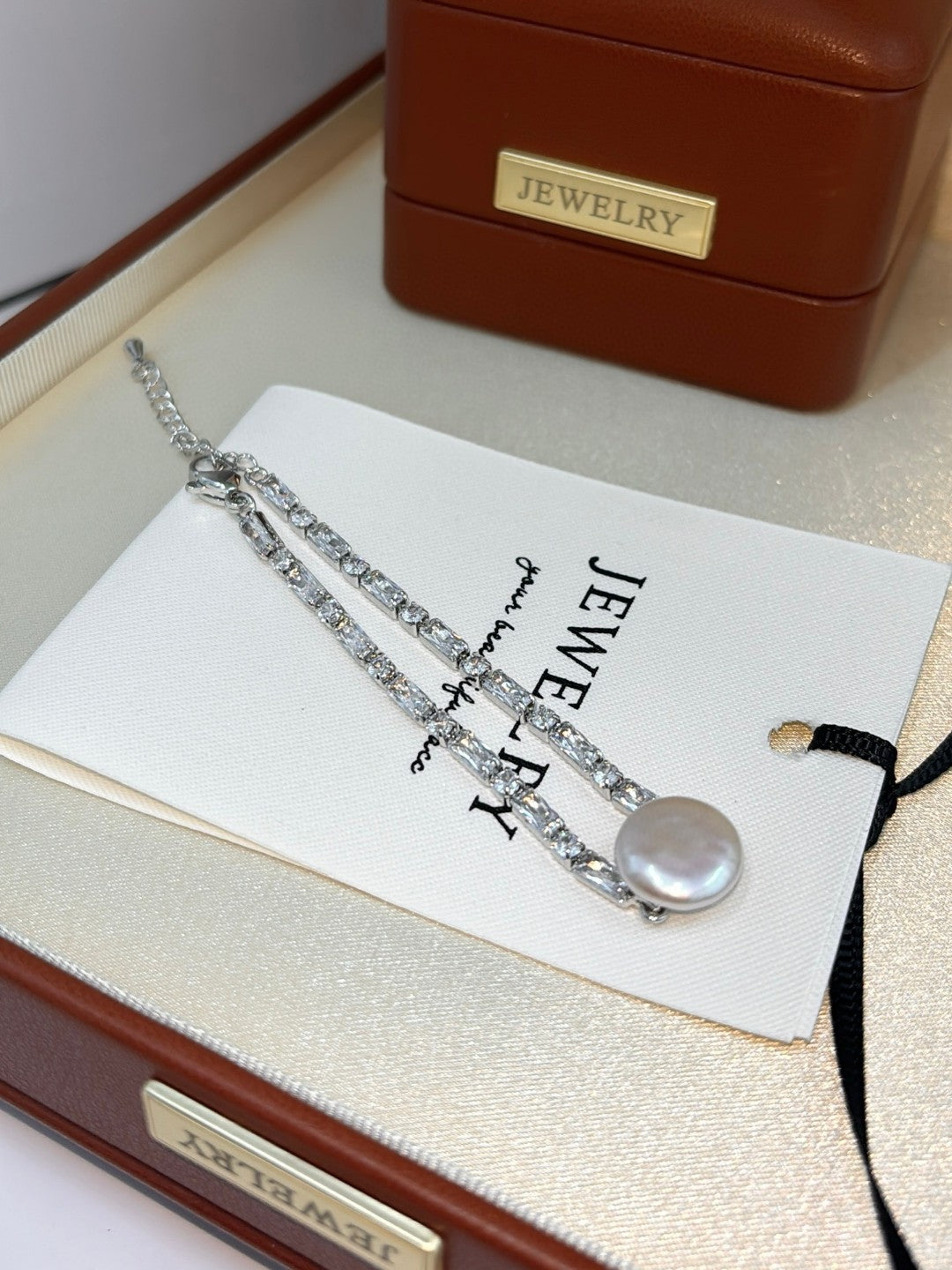 Baroque button pearl bracelet with aurora finish and zircon accents
