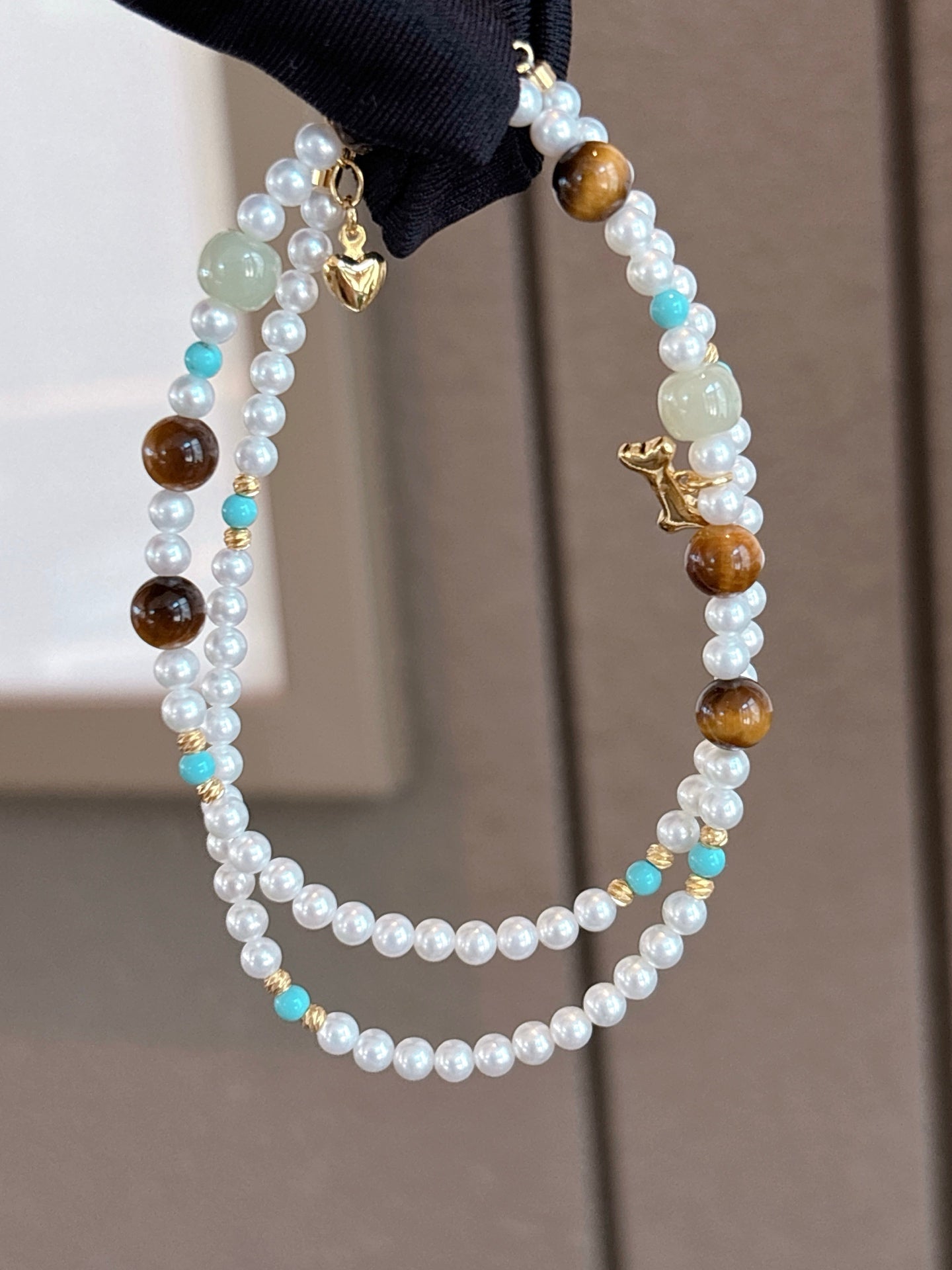 Close-up of 3.5–4mm aurora pearls and natural stone detailing