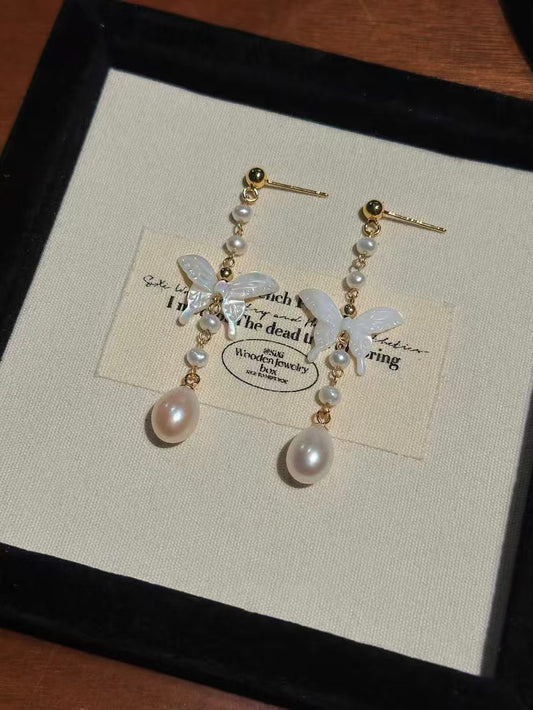 White mother-of-pearl butterfly earrings with tassels and freshwater pearls in Chinese-style design