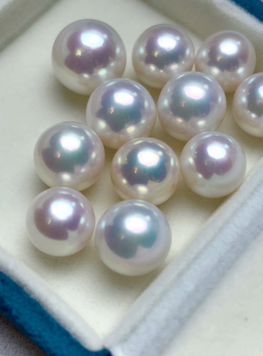 Close-up of a cool white, round Edison freshwater pearl with high luster