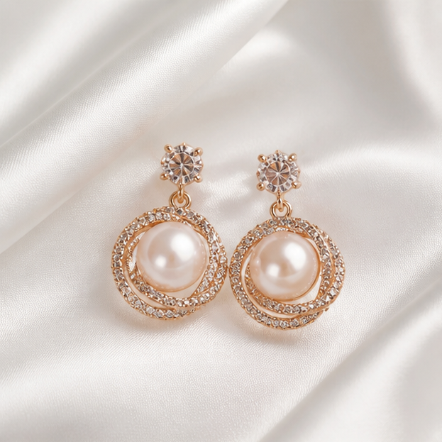 Matching rose-gold-tone pearl halo earrings with clear solitaire studs