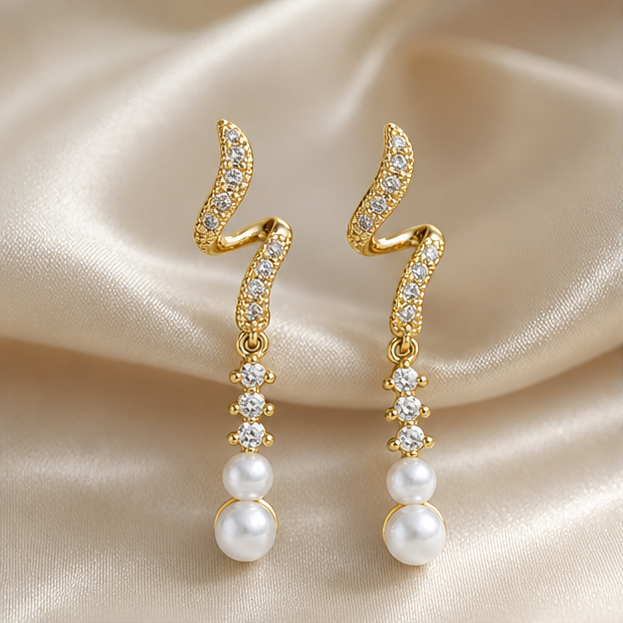 Galaxy Moonlight Tassel Earrings – Zircon & Freshwater Pearl photographed on ivory satin