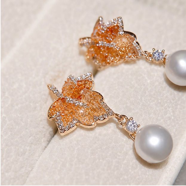 Macro product detail of Gradient Maple Leaf Crystal Earrings – Freshwater Pearl & Designer Edition