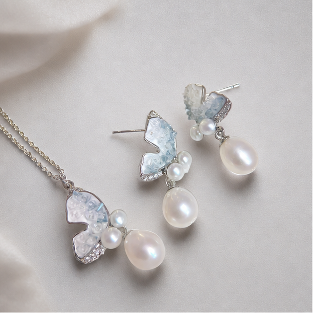 Clear Blue Ice Butterfly Set – Modern Oriental Style Freshwater Pearl Jewelry photographed on ivory satin